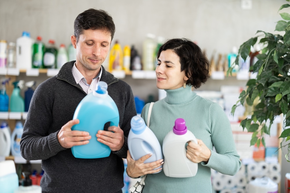 Married couple comparing natural cleaners against traditional cleaners